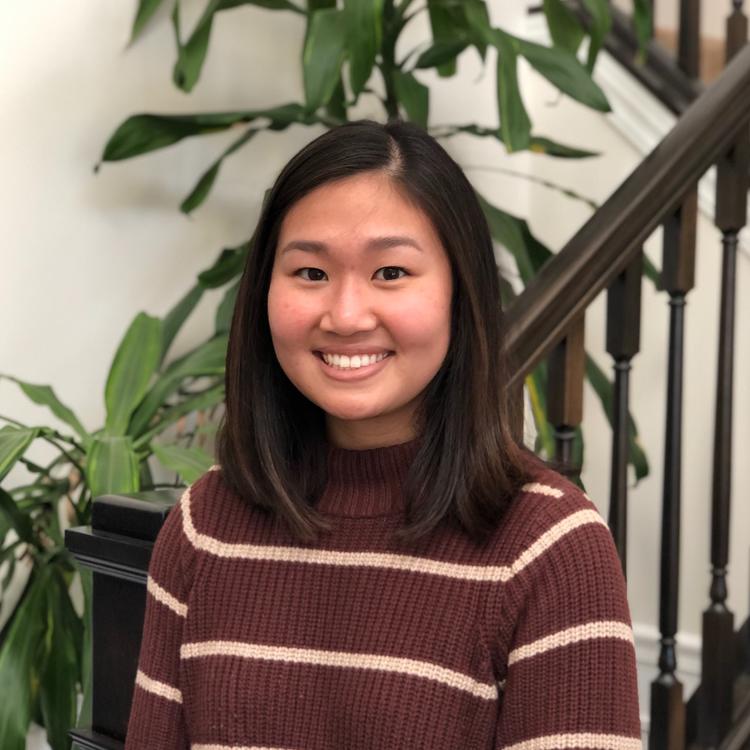Emily Chen in a brown shirt