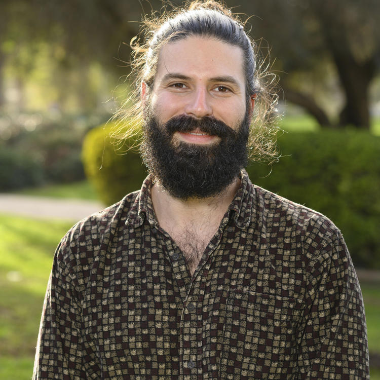 Ido Irani in a brown shirt