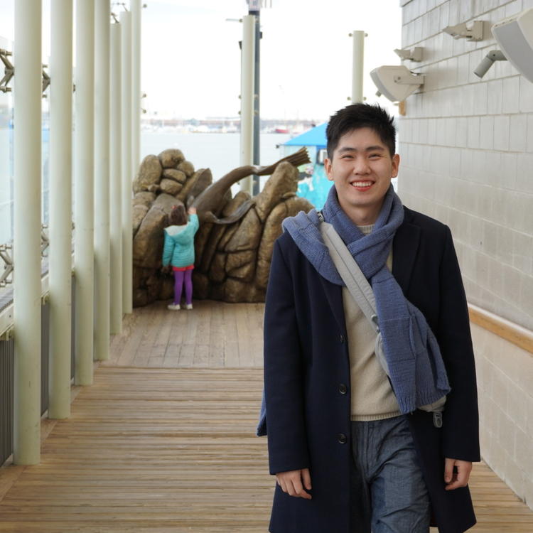 Zijang Chen in a black coat